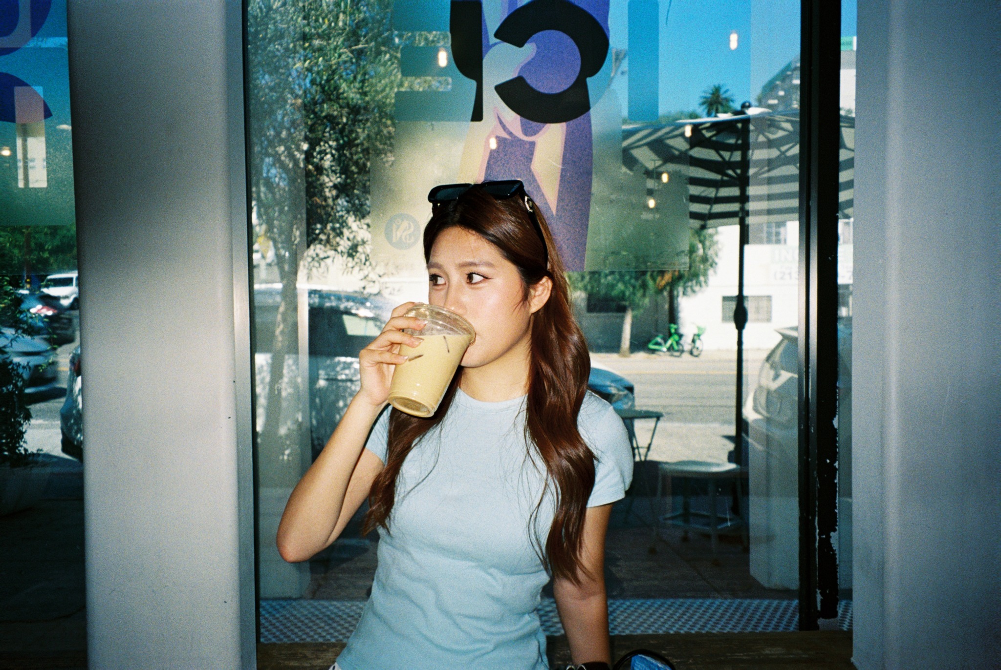 Annie drinking at a café