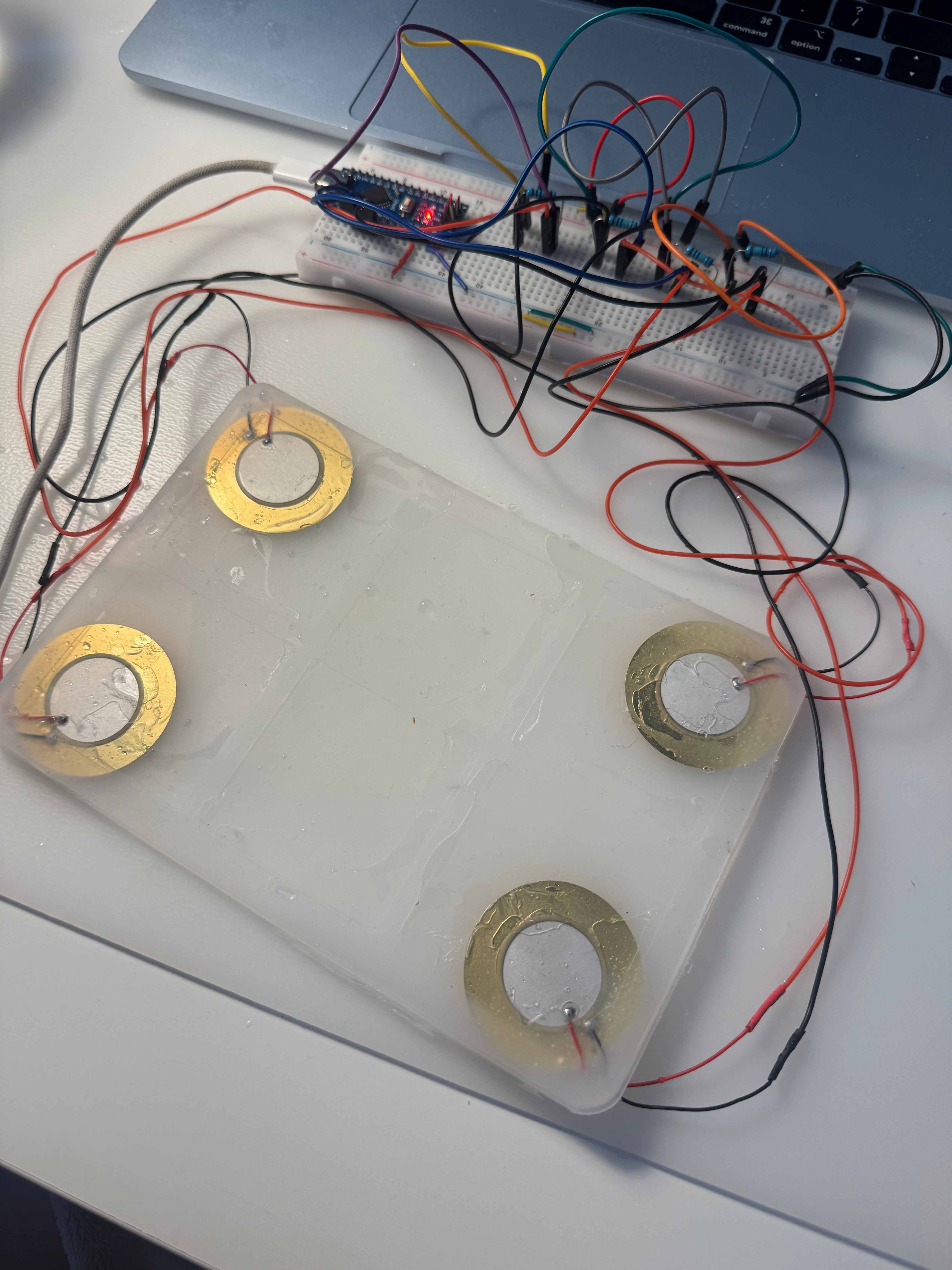 Physical prototype — four piezo sensors and wiring